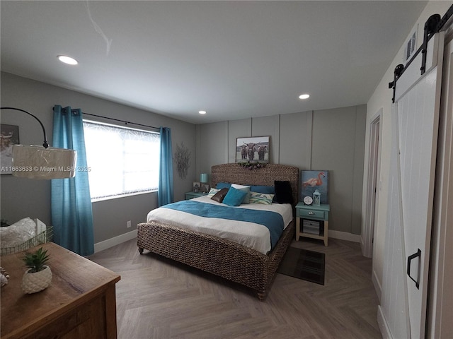 659 W Oakland Park Blvd Unit 218C, Oakland Park, FL 33311 - bedroom featuring a barn door and recessed lighting