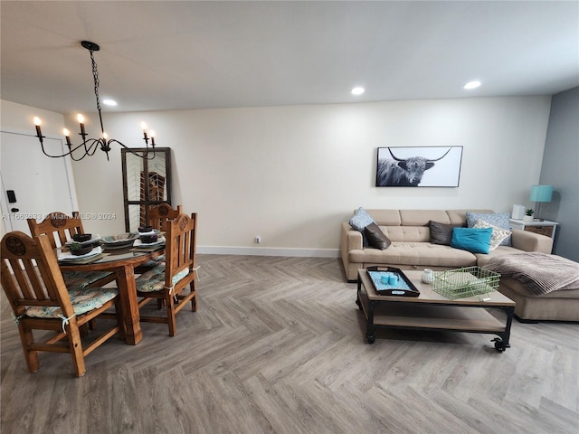 living room with parquet floors and a notable chandelier