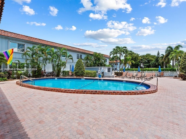 view of swimming pool with a patio