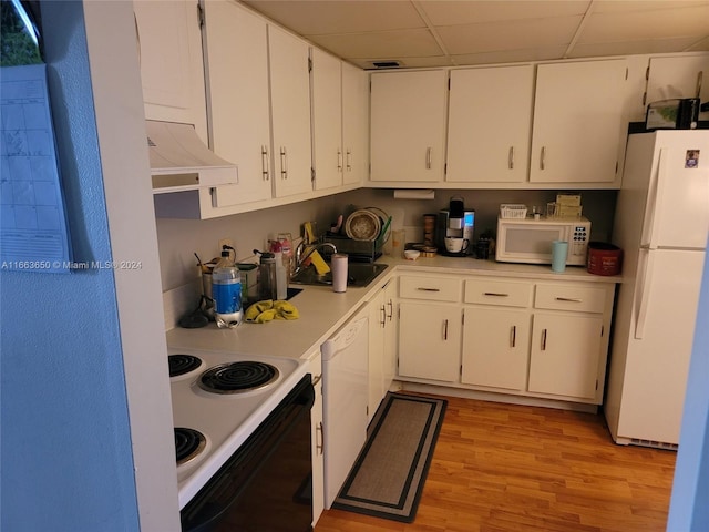 kitchen with range hood, sink, light wood-type flooring, white cabinetry, and white appliances