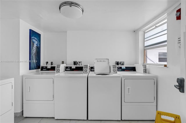 laundry room featuring separate washer and dryer