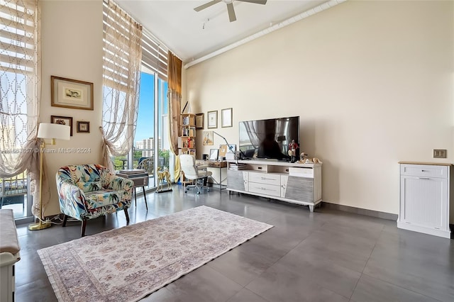 sitting room featuring high vaulted ceiling and ceiling fan