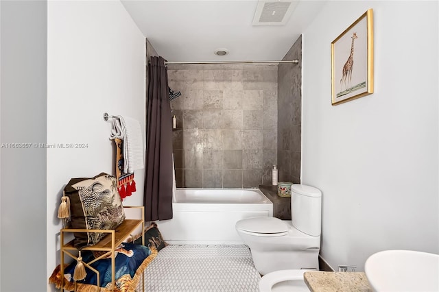 bathroom featuring shower / bath combo, toilet, and tile patterned flooring