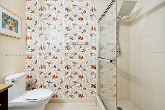 bathroom with vanity, toilet, tile patterned floors, and an enclosed shower