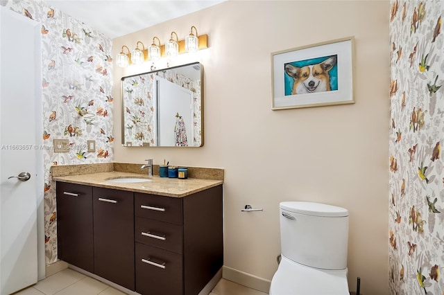 bathroom featuring toilet, vanity, and tile patterned floors