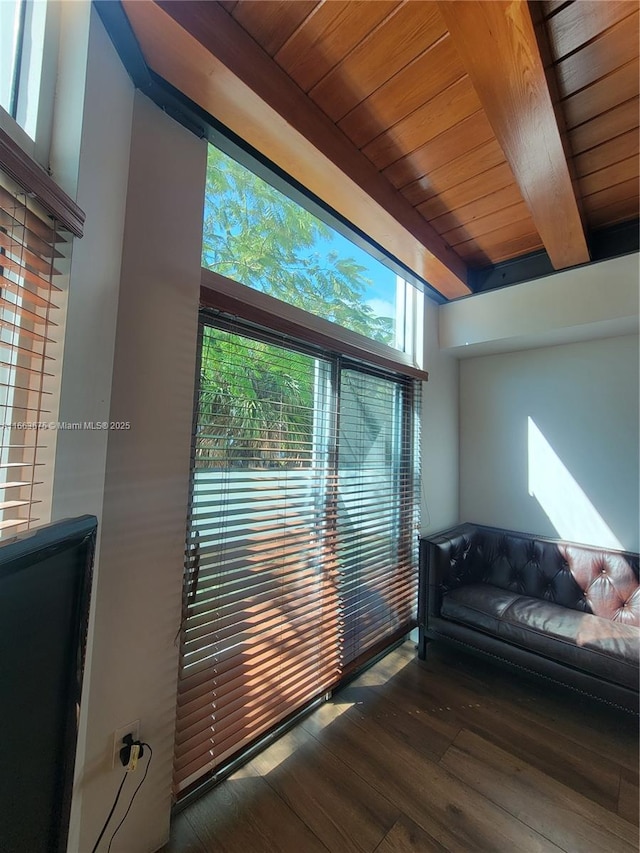 living room with dark hardwood / wood-style flooring, wood ceiling, and beamed ceiling