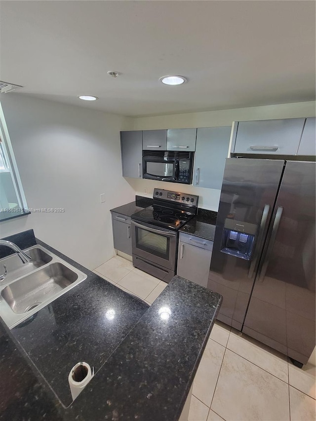 kitchen featuring gray cabinets, appliances with stainless steel finishes, sink, and light tile patterned floors