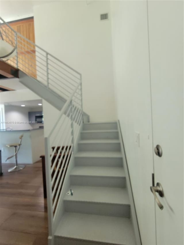 stairs with wood-type flooring