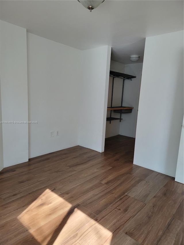 spare room featuring dark hardwood / wood-style floors