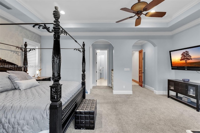 carpeted bedroom with ornamental molding and ceiling fan