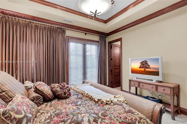 carpeted bedroom featuring crown molding