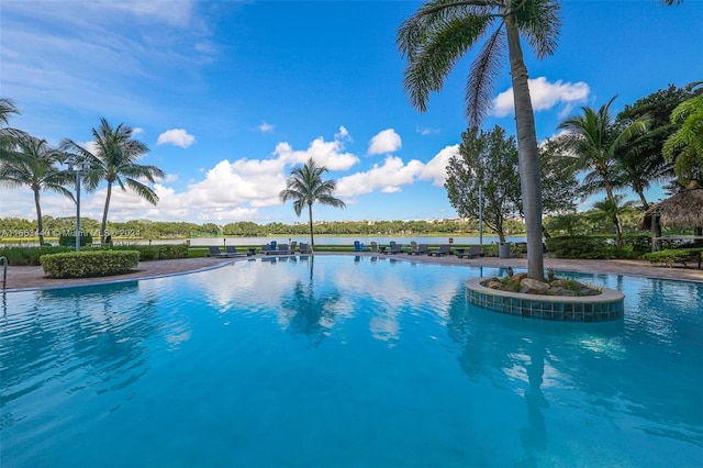 view of pool featuring a water view