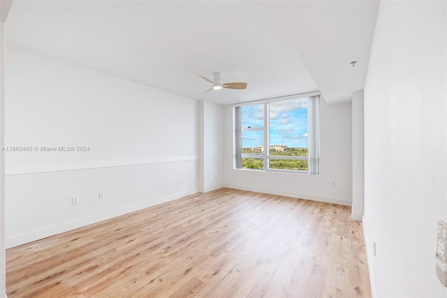 empty room featuring light hardwood / wood-style floors and ceiling fan