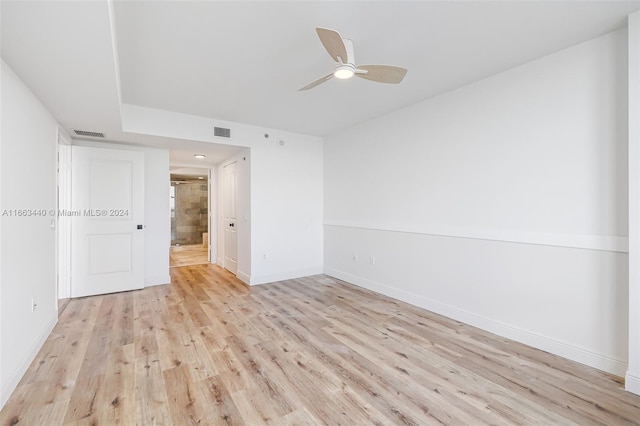 unfurnished room with ceiling fan and light hardwood / wood-style flooring