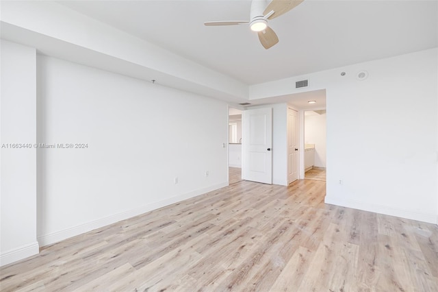 empty room featuring ceiling fan and light hardwood / wood-style floors