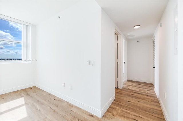 hall with light wood-type flooring