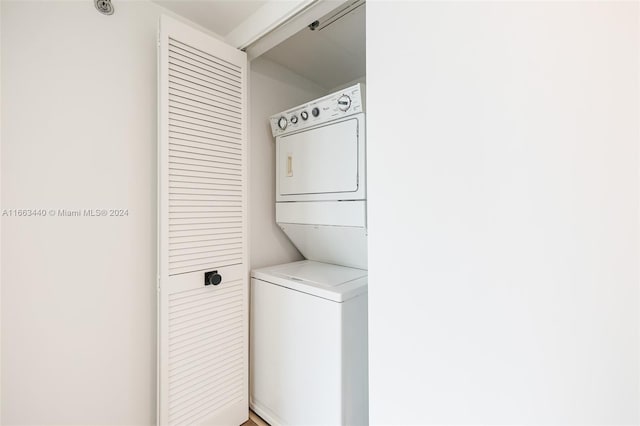 washroom with stacked washer / drying machine