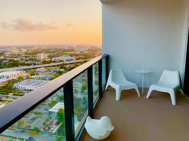 view of balcony at dusk