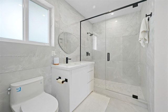 bathroom with walk in shower, vanity, and toilet