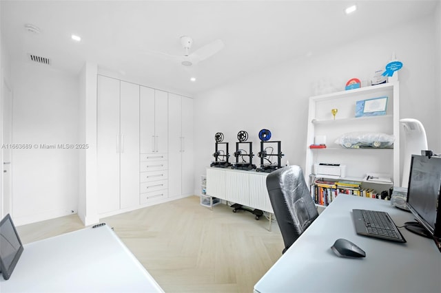 office space with light parquet flooring and ceiling fan