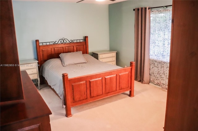 bedroom featuring ceiling fan and light colored carpet