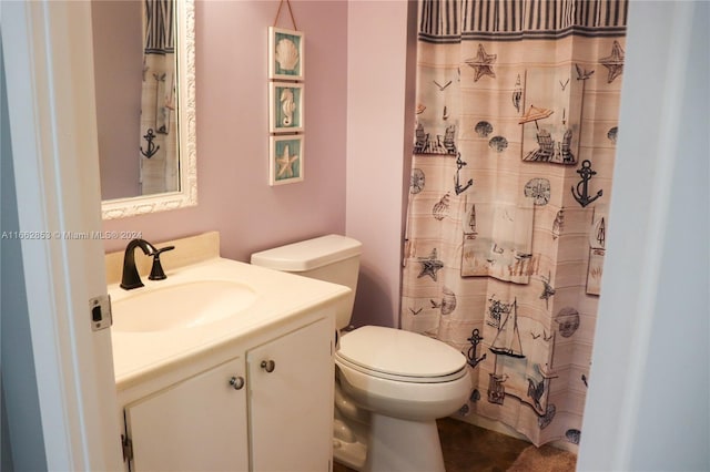 bathroom with tile patterned flooring, vanity, toilet, and a shower with curtain