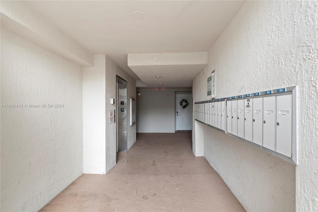 hall with mail boxes and elevator