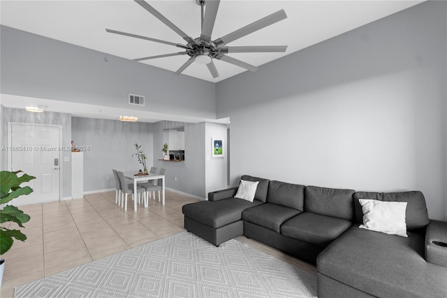 living room featuring ceiling fan and light tile patterned floors