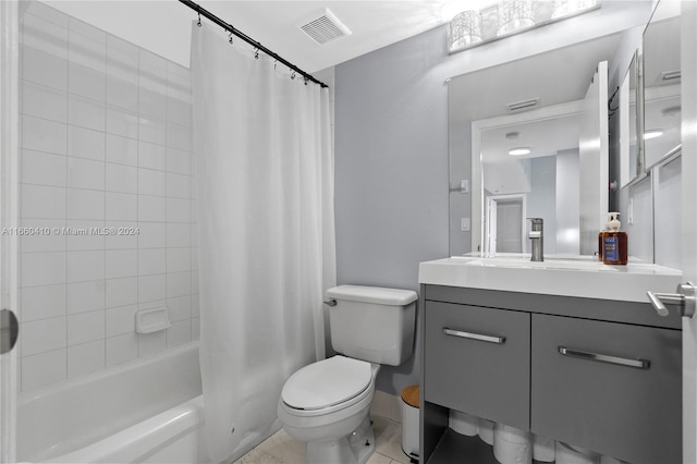 full bathroom with toilet, shower / bath combo, vanity, and tile patterned flooring