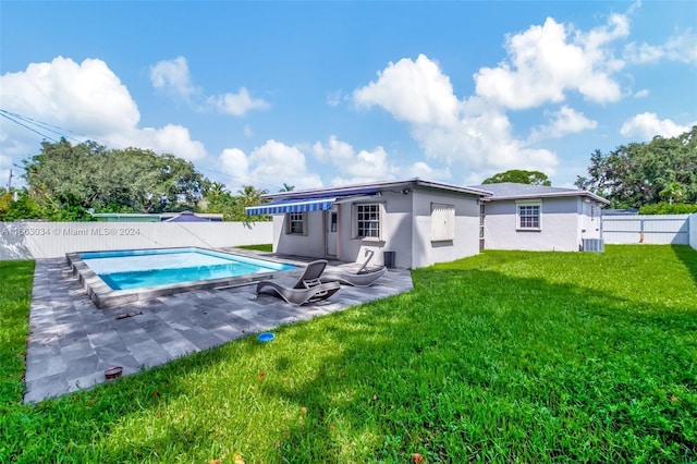 540 NE 142nd St, North Miami, FL 33161 - rear view of house with stucco siding, a patio area, and central AC