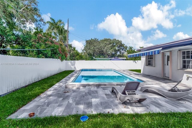540 NE 142nd St, North Miami, FL 33161 - view of swimming pool with a fenced backyard and a patio area
