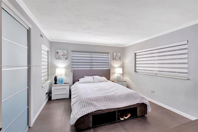540 NE 142nd St, North Miami, FL 33161 - tiled bedroom with ornamental molding and baseboards