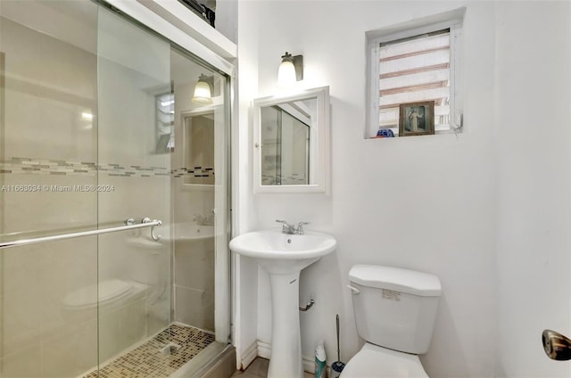 540 NE 142nd St, North Miami, FL 33161 - bathroom featuring toilet, a shower stall, and a sink