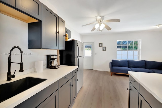 540 NE 142nd St, North Miami, FL 33161 - kitchen with a sink, light countertops, freestanding refrigerator, ceiling fan, and open floor plan