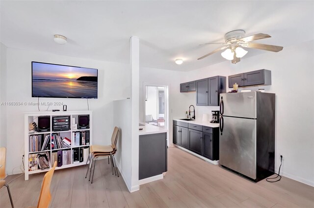 540 NE 142nd St, North Miami, FL 33161 - kitchen featuring freestanding refrigerator, a sink, ceiling fan, light countertops, and light wood-style floors