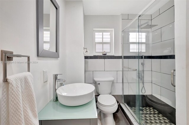 540 NE 142nd St, North Miami, FL 33161 - bathroom with toilet, a shower stall, and vanity