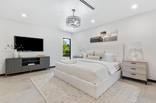 bedroom featuring a chandelier