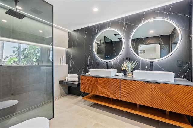 bathroom featuring vanity, tile walls, toilet, and an enclosed shower