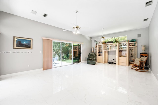 unfurnished living room with ceiling fan