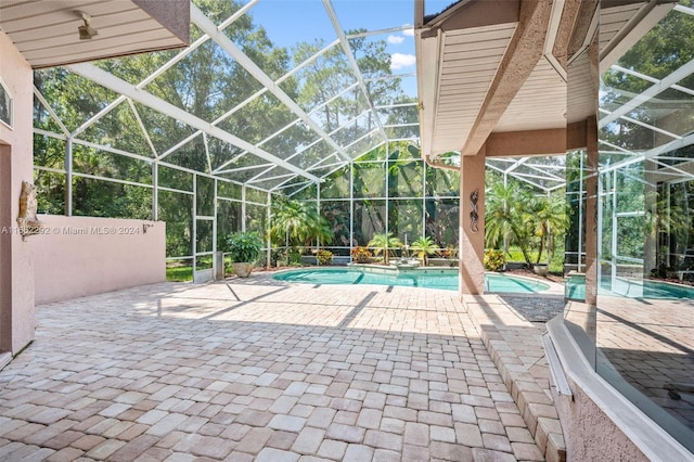 view of pool featuring a patio and a lanai