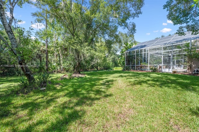 view of yard featuring a lanai