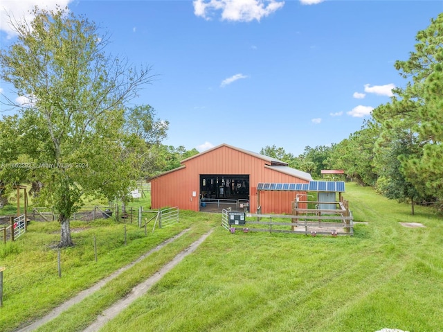 view of yard featuring an outbuilding and a rural view