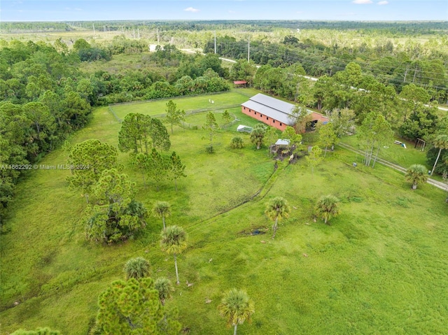 birds eye view of property with a rural view