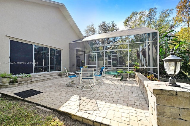 view of patio / terrace with glass enclosure