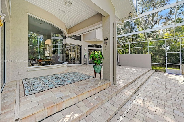 view of patio with a lanai