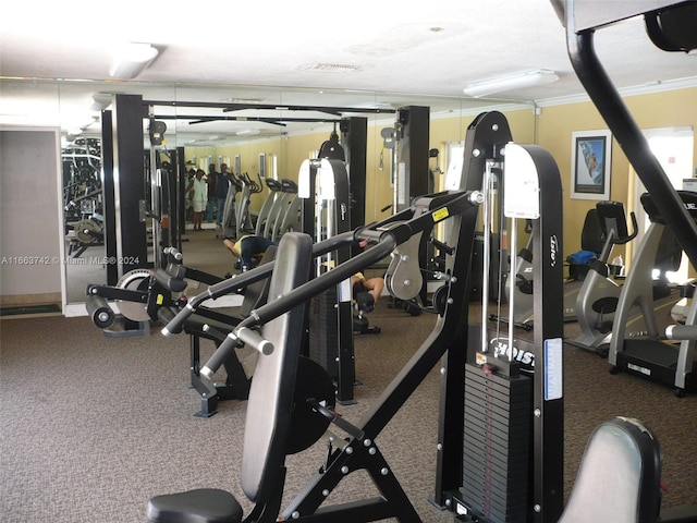 exercise room with ornamental molding