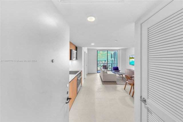 kitchen featuring light tile patterned floors and stainless steel appliances