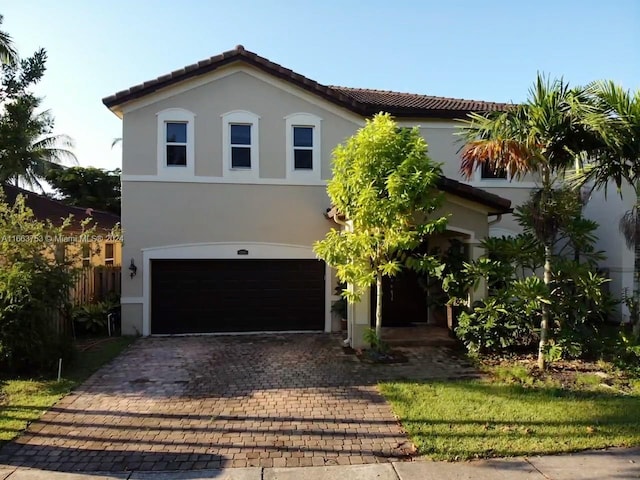 mediterranean / spanish-style home featuring a garage