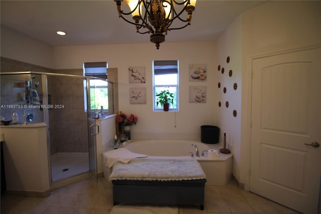 interior space featuring separate shower and tub, a notable chandelier, and tile patterned floors