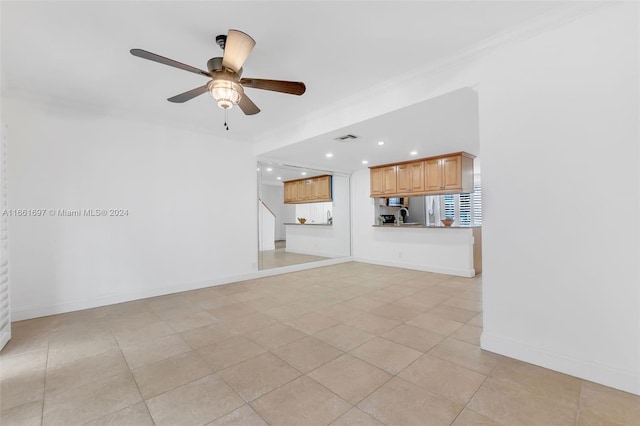 unfurnished living room featuring ornamental molding, ceiling fan, and light tile patterned flooring